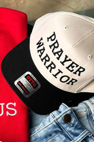 Tan and black hat with text 